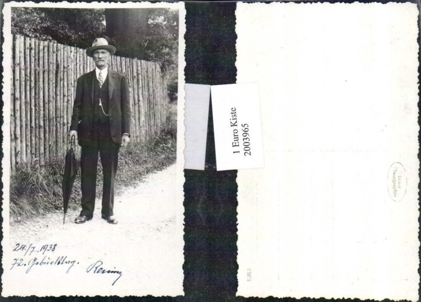2003965, Photo of man with hat and umbrella, 1938