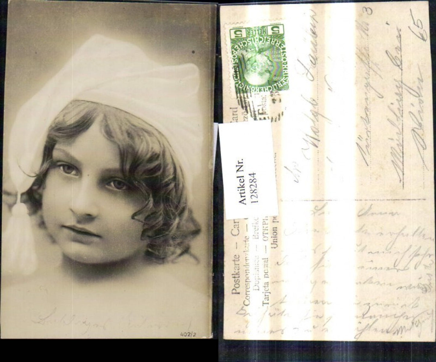 128284,Kind Lockenkopf m. Schlafmütze Portrait