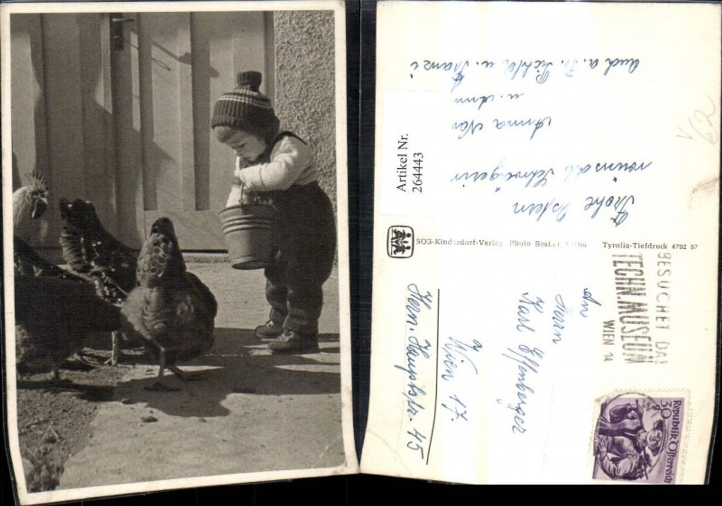 264443, SOS Children's Village child boy b. feeding chickens rooster bucket