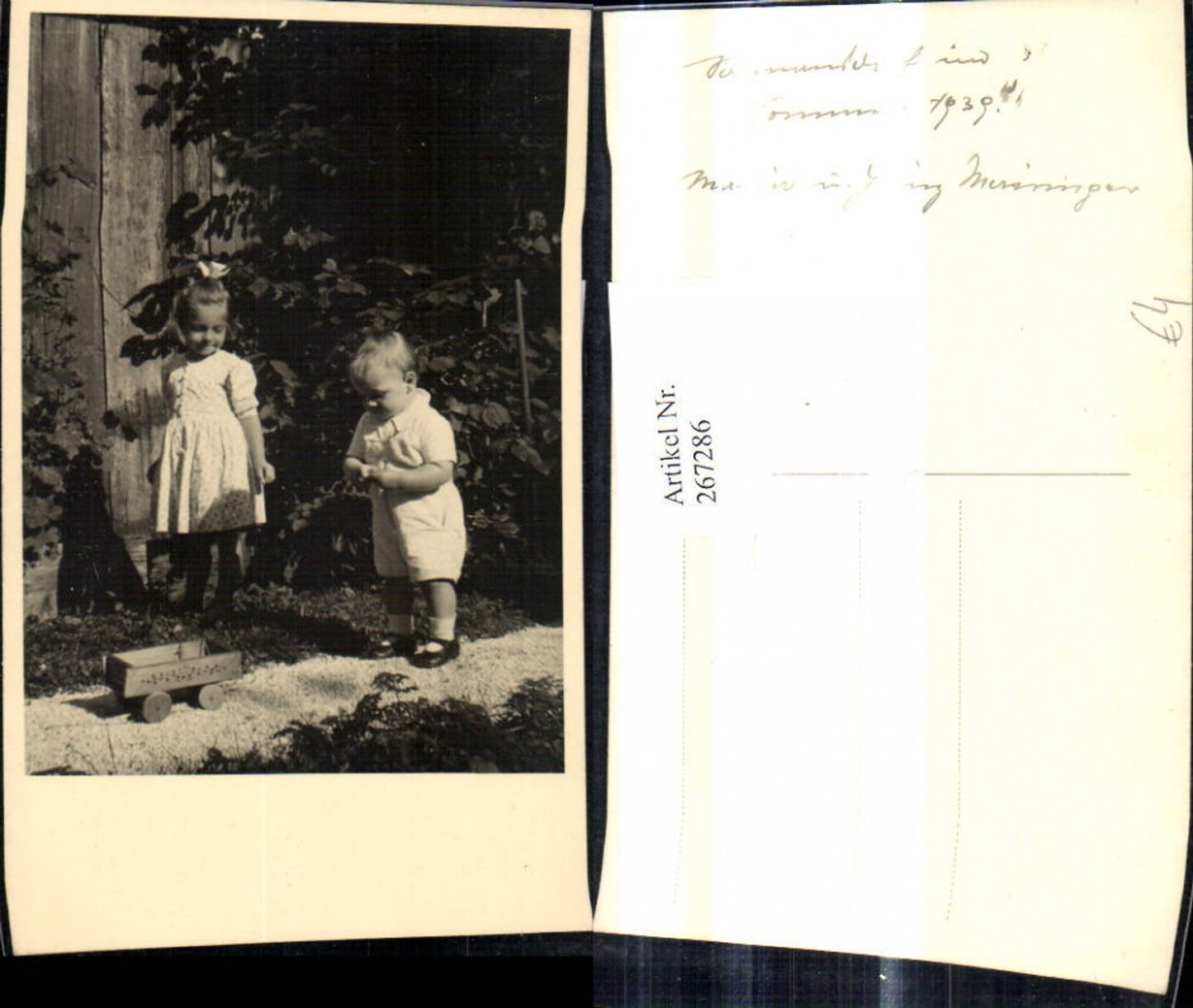 267286,Foto Ak Kind Kinder m. Leiterwagen v. Haus Garten 1939