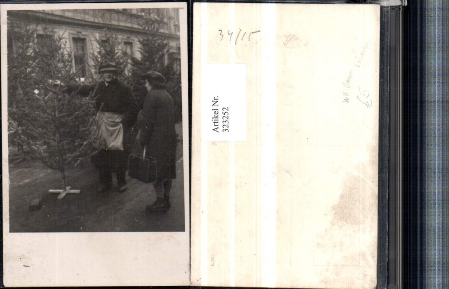 323252, Photo AK Christmas tree seller woman with bag