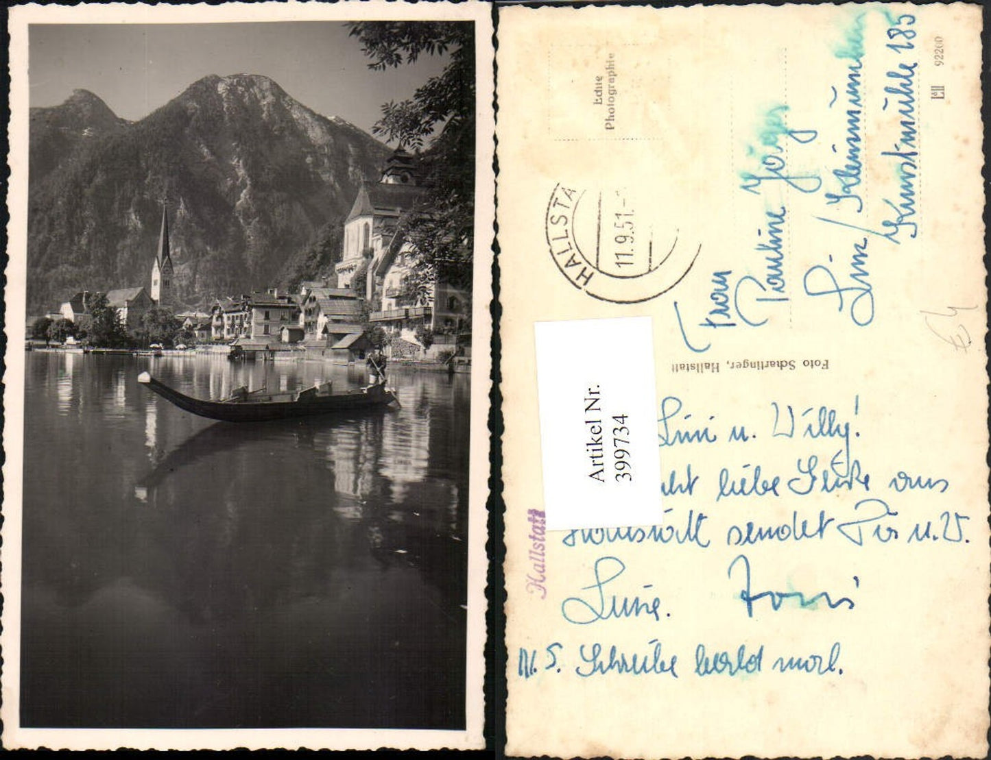 399734,Hallstatt Teilansicht Kirche Boot Bergkulisse