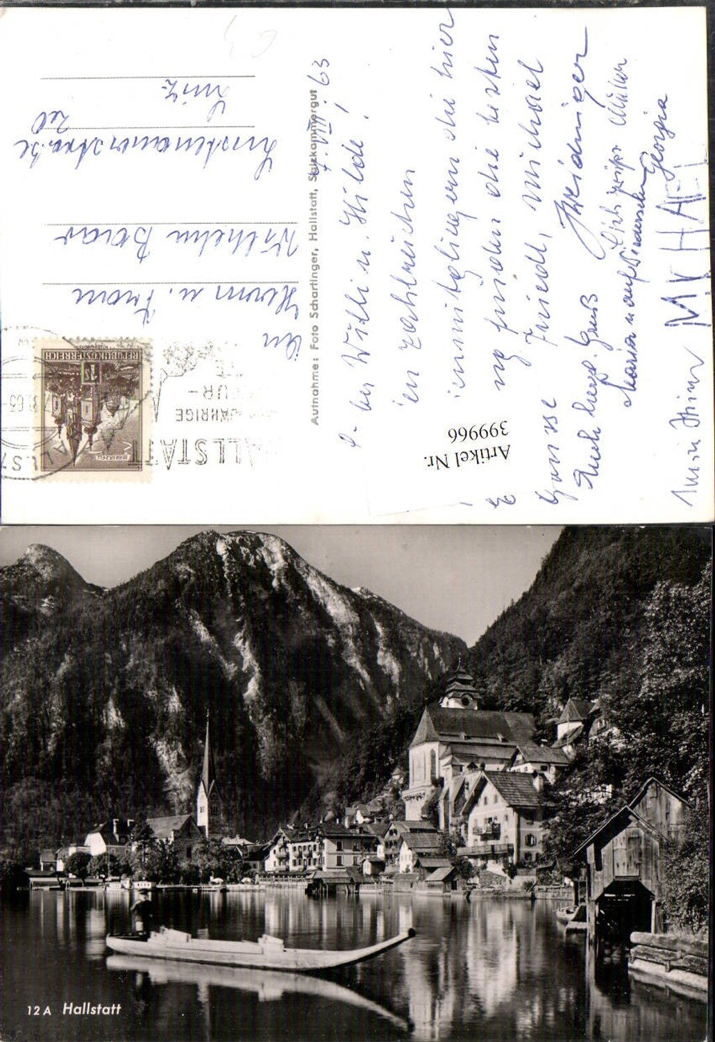 399966,Hallstatt Teilansicht Boot Kirche Bergkulisse