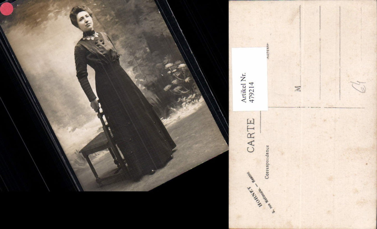 479214, Woman in black dress standing on chair