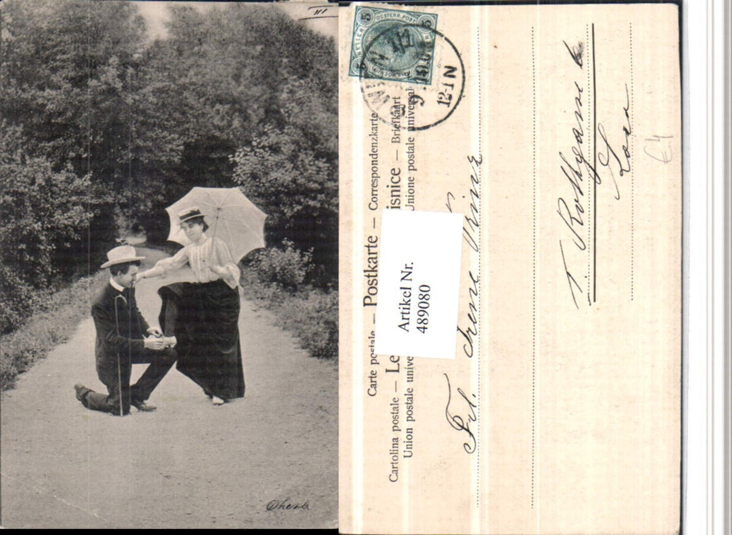 489080,Lovely couple, man ties woman's shoes, umbrella