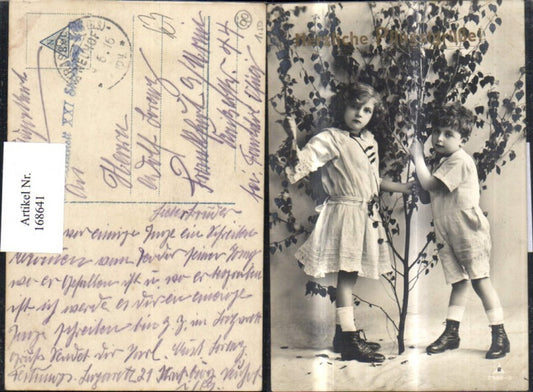 168641, Easter girl boy bush