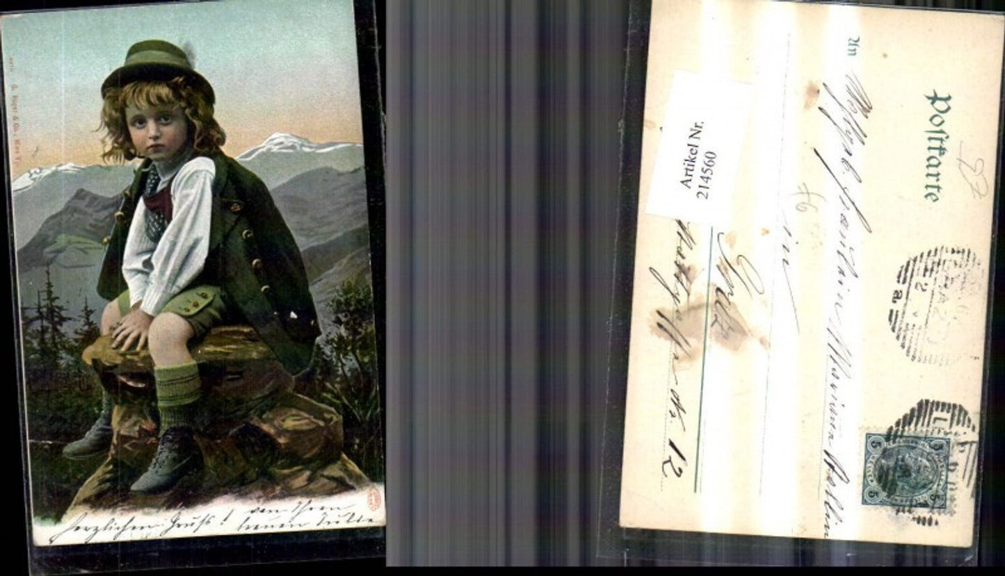 214560, Child boy in traditional costume against a mountain backdrop