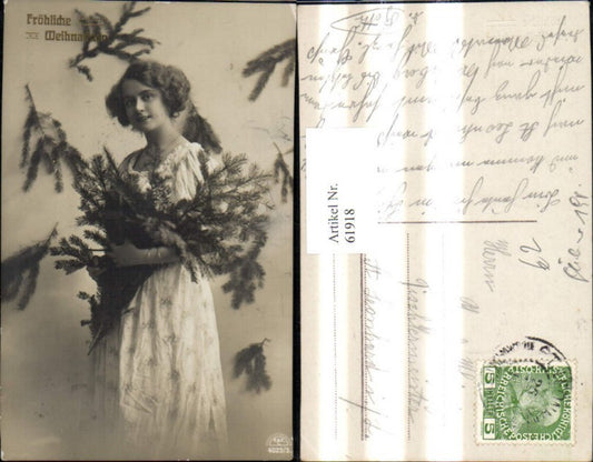 61918, Christmas woman with fir branches