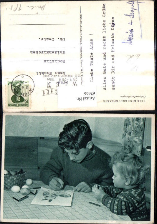 62666,SOS Kinderdorf Kinder Junge malt Bild Hasen Ostervorbereitungen Ostereier