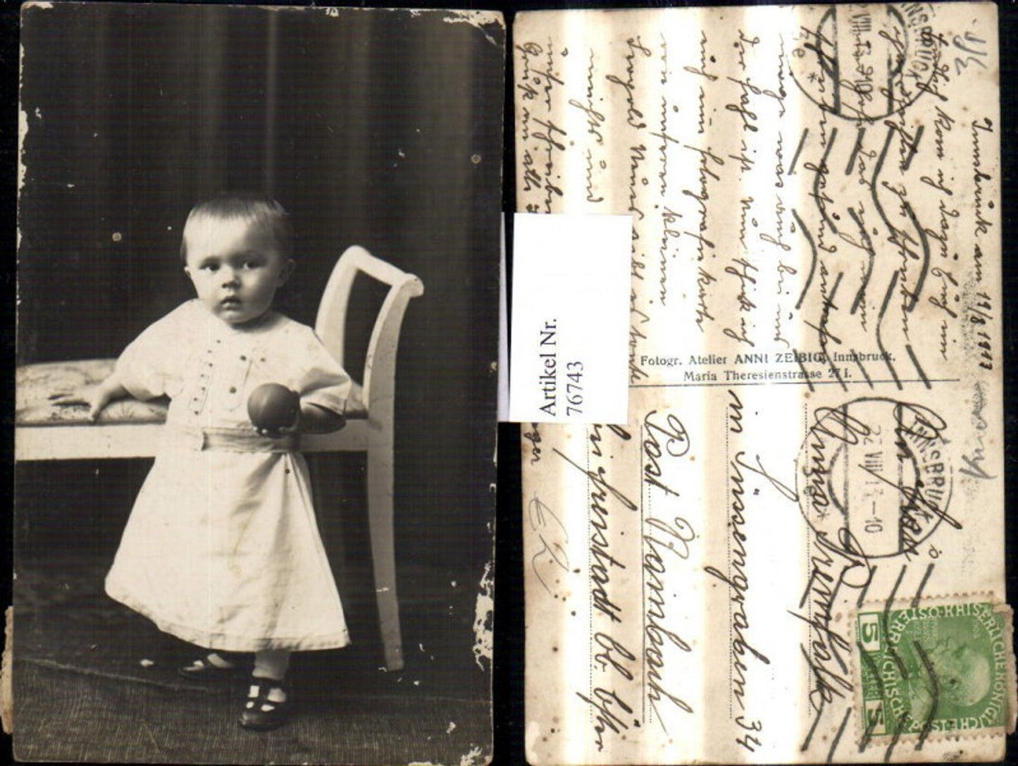 76743, Child girl with ball at bench