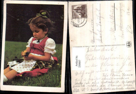 230887, SOS Children's Village girl with dress, traditional costume, flowers, meadow