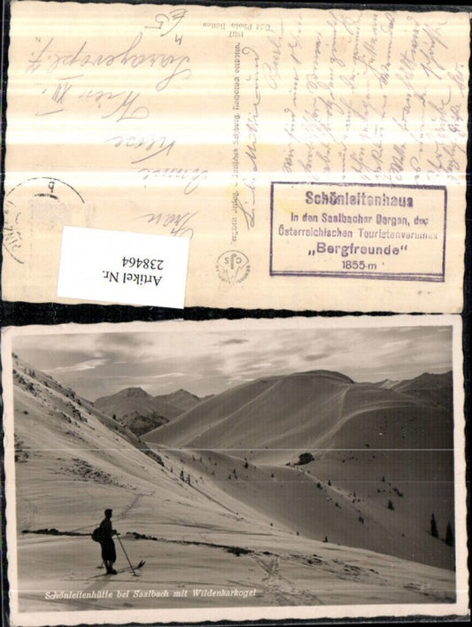 238464,Schönleitenhütte Berghütte b. Saalbach m. Wildenkarkogel Skifahrer Winterbild