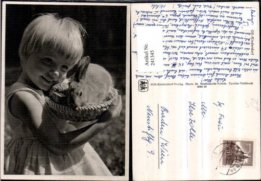 241345, SOS Children's Village girl with dress, basket, rabbit, Easter eggs