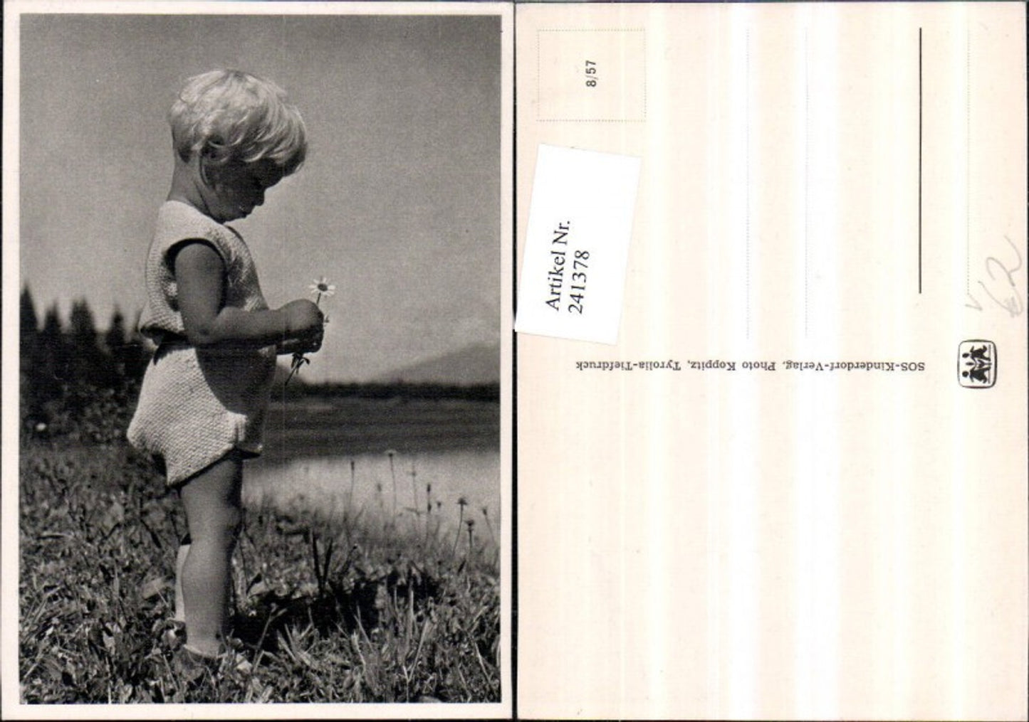 241378, SOS Children's Village 8/57 Child with flower daisy meadow