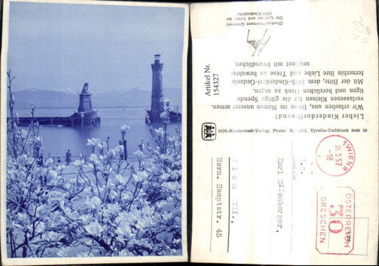 154327,Lindau a. Bodensee Leuchtturm Hafeneinfahrt Löwendenkmal Baumblüte i. Vordergrund pub SOS Kinderdorf