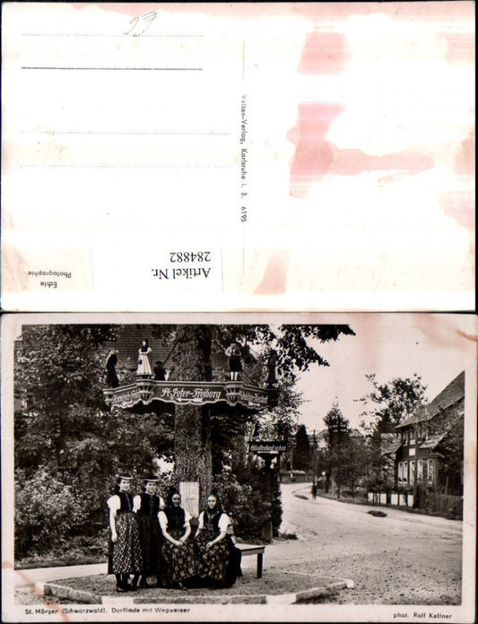 284882, St. Märgen in the Black Forest, village linden tree with signpost, women in traditional dress