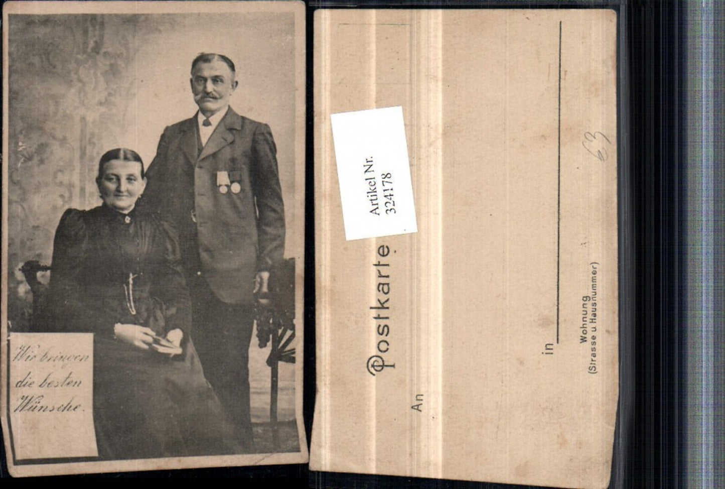 324178,Mann m. Bart Frau m. Buch Paar Portrait