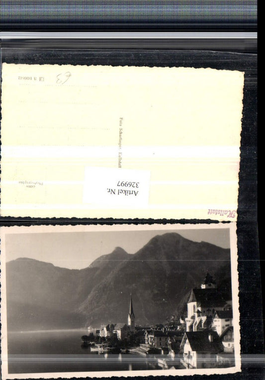 326997,Hallstatt Teilansicht Kirche Bergkulisse