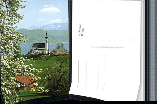 327438,Attersee am Attersee Kirche Baumblüte Bergkulisse