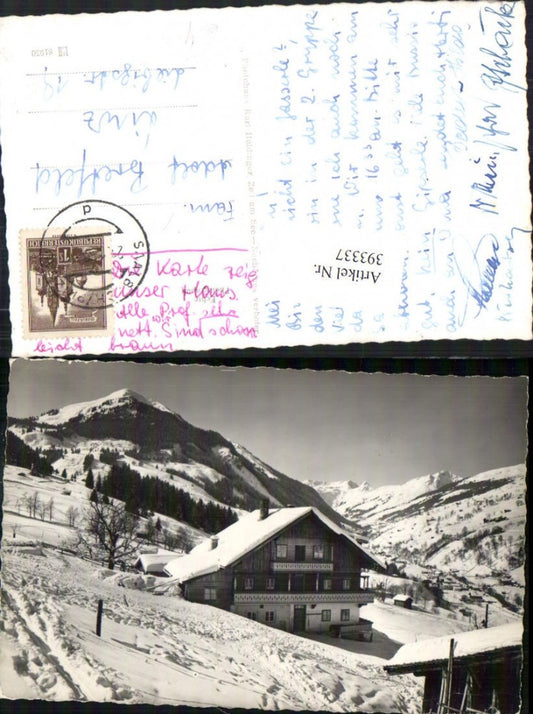 393337,Saalbach Teilansicht Haus Bergkulisse Winterbild