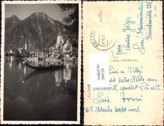 399734,Hallstatt Teilansicht Kirche Boot Bergkulisse