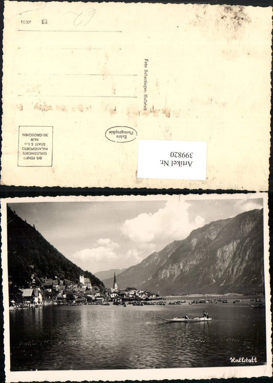 399820,Hallstatt Teilansicht Prozession Boote Bergkulisse