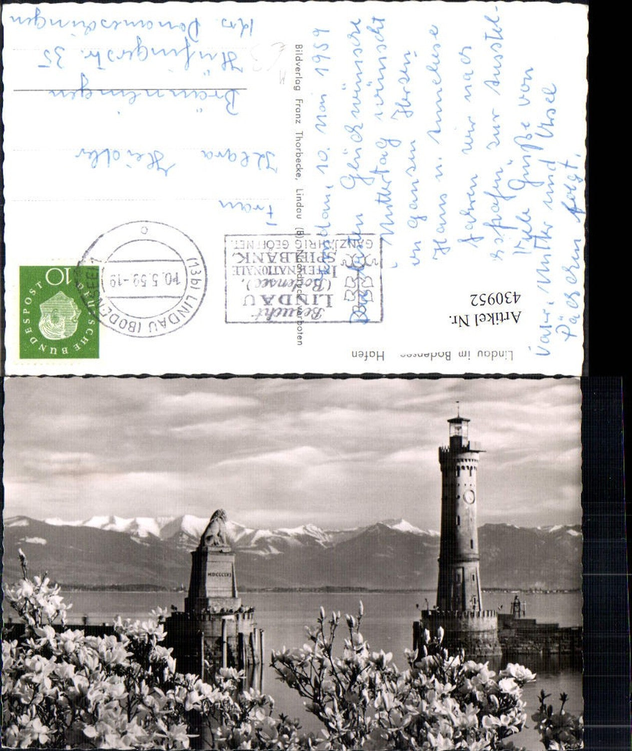 430952,Leuchtturm Lindau a. Bodensee Hafen Löwendenkmal Magnolienblüten i. Vordergrund