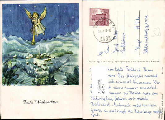 452252,Künstler AK E. Pirard Weihnachten Engel Flöte Winterdorf Bergkulisse