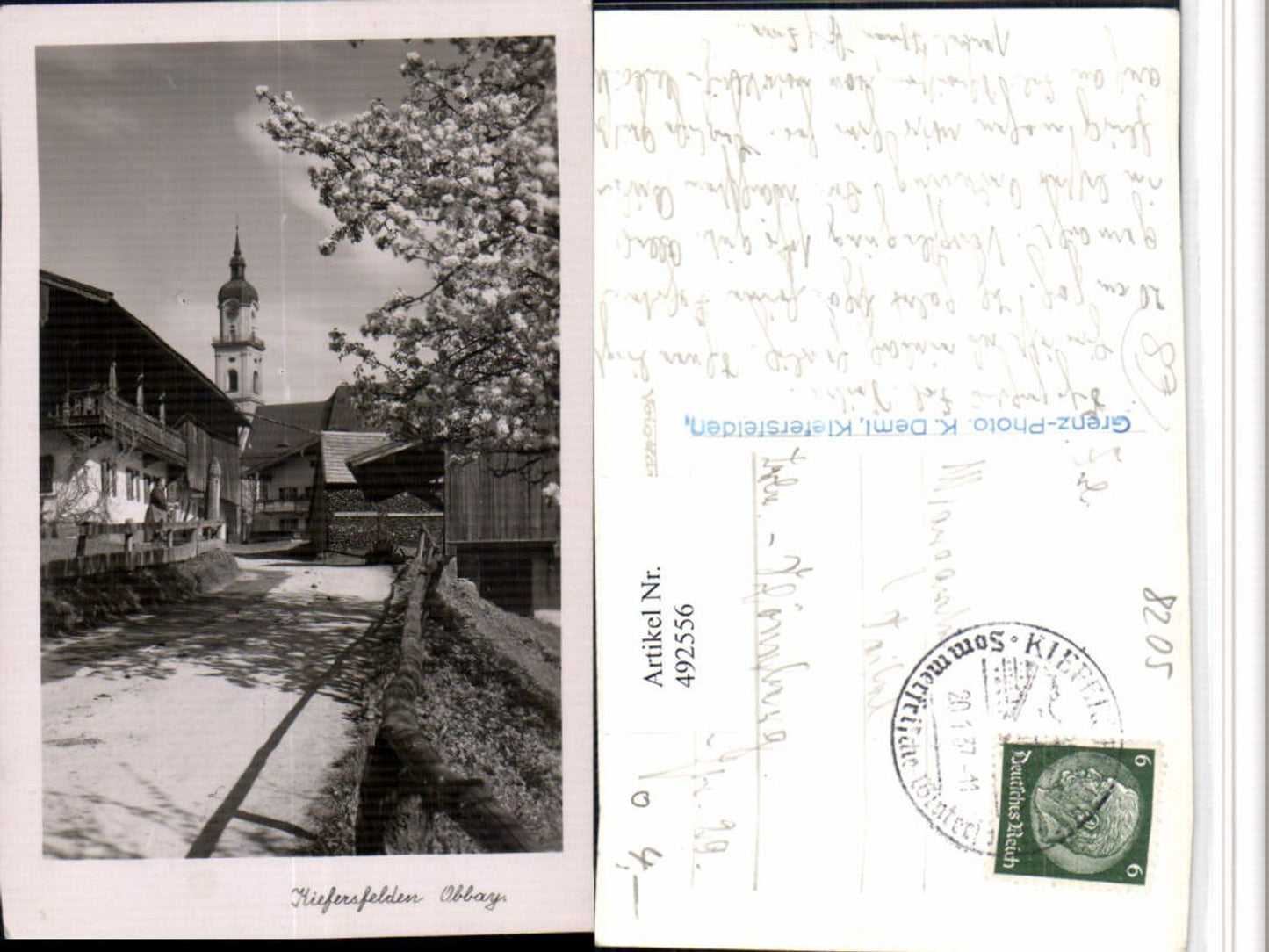 492556,Kiefersfelden Straßenansicht Kirche Baumblüte