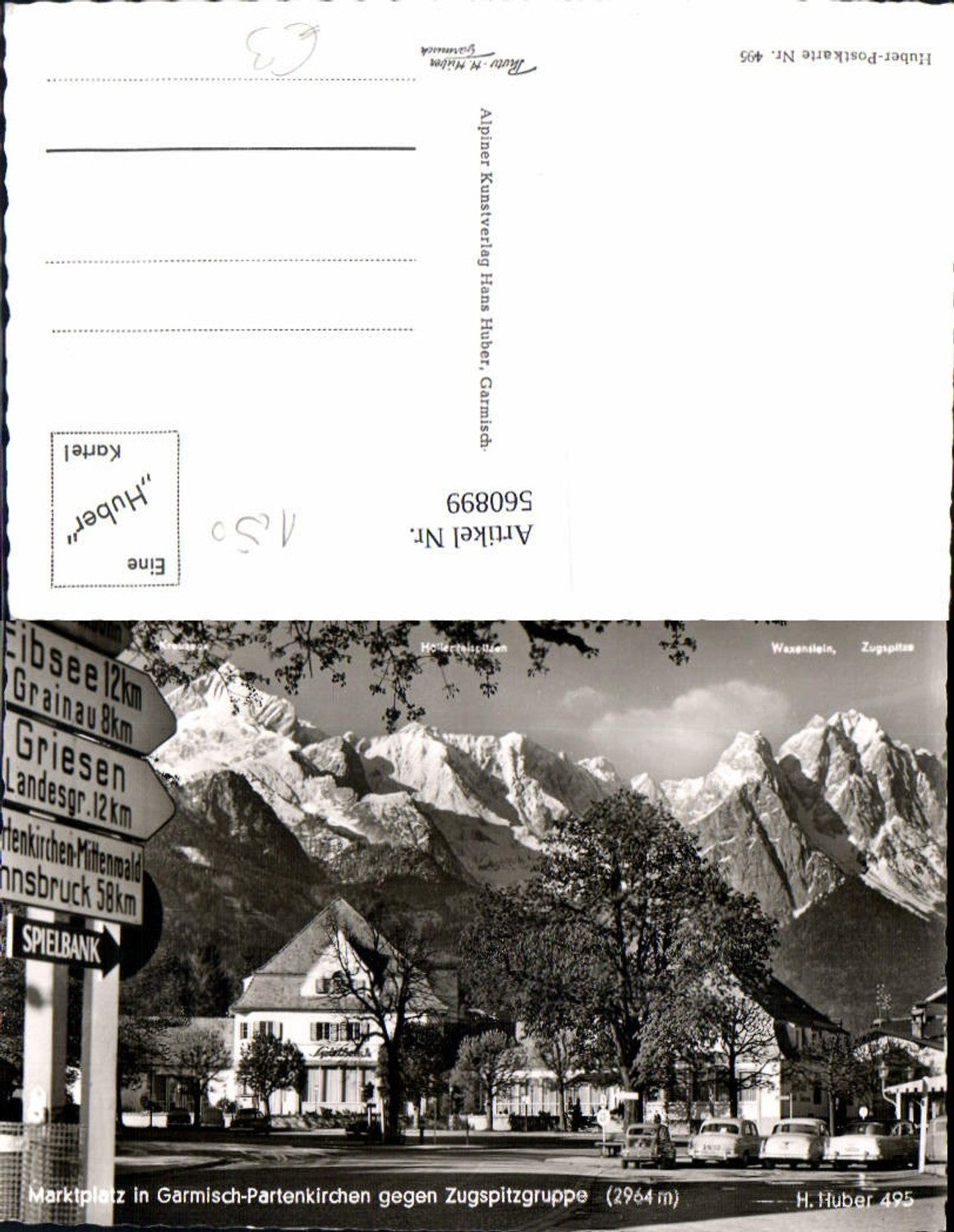 560899,Foto Ak Marktplatz Garmisch-Partenkirchen geg. Zugspitzgruppe Wegweiser