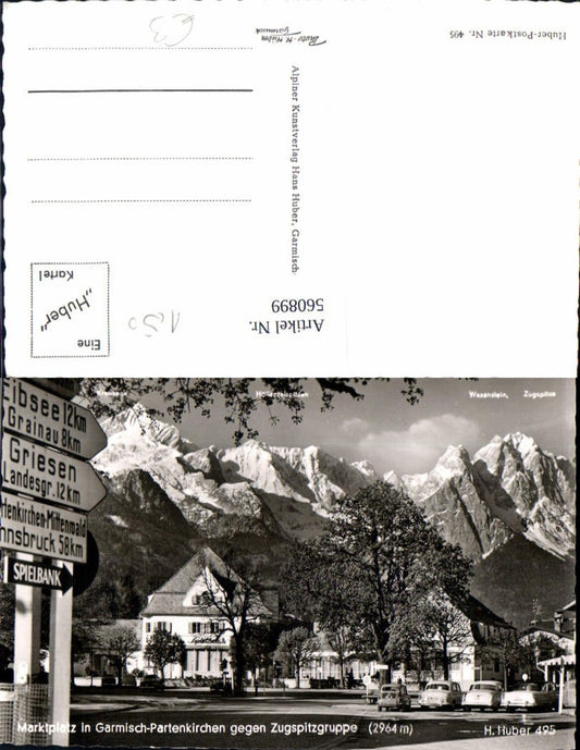 560899,Foto Ak Marktplatz Garmisch-Partenkirchen geg. Zugspitzgruppe Wegweiser