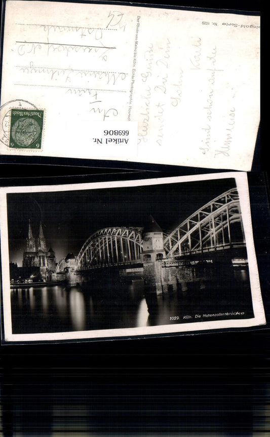 669806,Foto Ak Köln Die Hohenzollernbrücke Brücke b. Nacht Dom Bauwerk